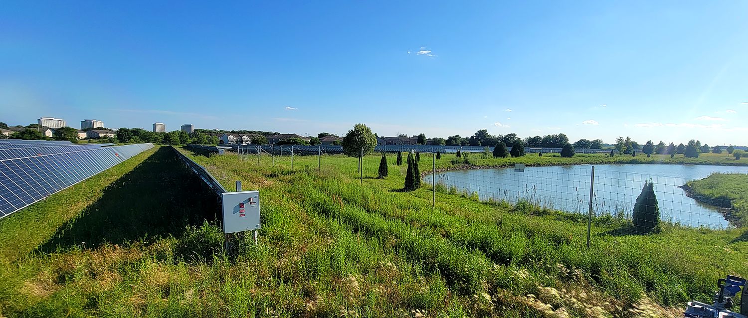 Community solar array beside a residential development
